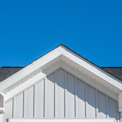 Gable Roof With White Fascia, Gray Vertical Vinyl Lap Siding Blu