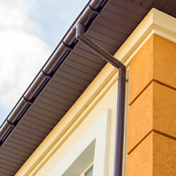 Close Up Detail Of Cottage House Corner With Brown Metal Planks